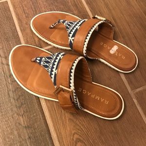 Navy, white, and tan sandals